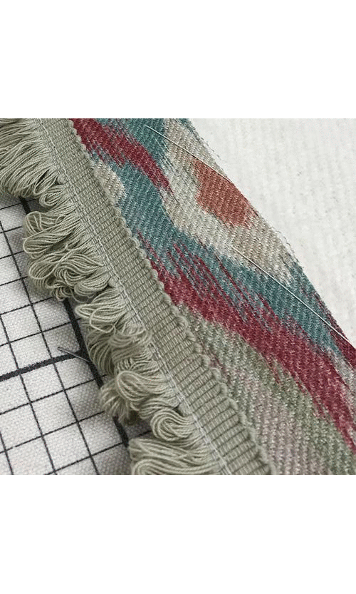 Roman blinds with decorative fringe trim