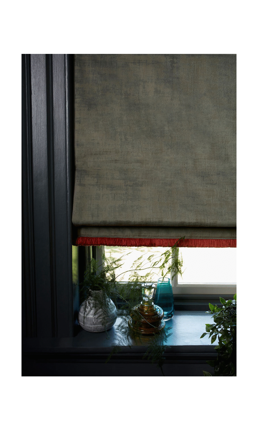 Roman blinds with decorative fringe trim